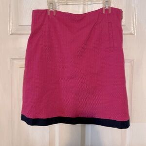 Pink with navy blue trim. Side zip